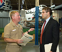 History professor Jeremi Suri (right) talks with Captain Ken Auten, professor of naval science and  commander of the naval ROTC program at UW-Madison, after a lecture on grand strategy. Last summer, Suri gave an online course in grand strategy designed to accommodate active-duty personnel. Photo: Shawn Harper