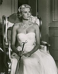 Kelly, wearing the final version of the dress, also wore Head’s designs in the Hitchcock film Rear Window.