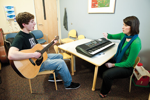 Wilder Deitz (left) and Sarah Blakeslee (right) practice techniques for avoiding voice fatigue and a sore throat, including “safe screaming.”