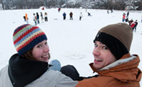 Eileen Bennett x’12 and her brother, Peter Bennett ’07, joined the sledding frenzy on Observatory Hill when classes were canceled last December due to a  snowstorm. True to tradition, cafeteria trays were  the conveyance of choice.