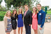 Kelly Kahl ’89, executive vice president with CBS Primetime Television (in suit), accepted his Badger of the Year award from the WAA: Los Angeles Chapter at its May Founders’ Day. With Kahl are former CBS interns (left to right) Mallory Mason ’08, Alexis Krinsky ’08, Alexa Sunby ’12, Emily Coleman ’12, and Dan Brower ’11. All are now working in the L.A. entertainment industry. Don Milici photo.
