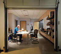 With a nod to his company’s modest — but plucky — roots, Fred Foster enters his Middleton office through a garage door.