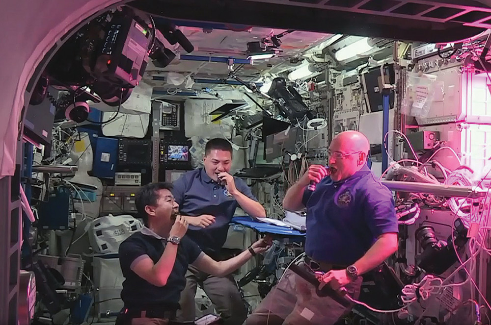 astronauts space grown lettuce
