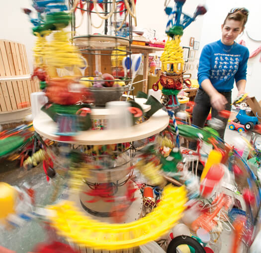 Art_loft_grad_studio09_3023_525 Round and round and round it goes, where it stops, nobody knows. Ginger Lukas MFAx’11 gives her mixed-media project a hearty spin as she contemplates where to place the next element while working in her studio space at the Art Lofts, which opened on campus last year.