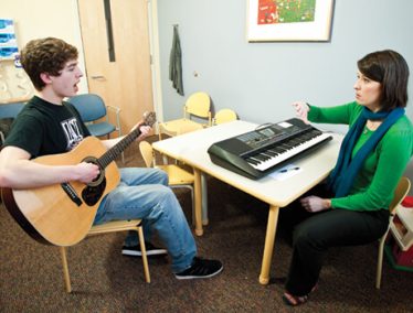 Wilder Deitz (left) and Sarah Blakeslee (right) practice techniques for avoiding voice fatigue and a sore throat, including “safe screaming.”