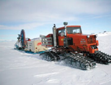 The shot-hole drill (shown during a test near McMurdo Station) carves holes in glaciers in Antarctica. It can drill ice at a rate of six meters per minute, cutting up to twenty holes each day. The drill’s bit is made of steel and tungsten, but the key element is compressed air, used to drive the drill, suspend it over the ice, and clear chips out of the hole.