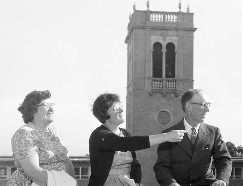 Archival photo of parents in front of Carillon