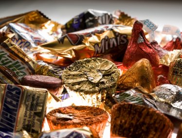 Close-up of plate of candy bars and chocolates.