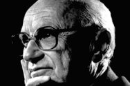 Black and white closeup photo of Milton Friedman.