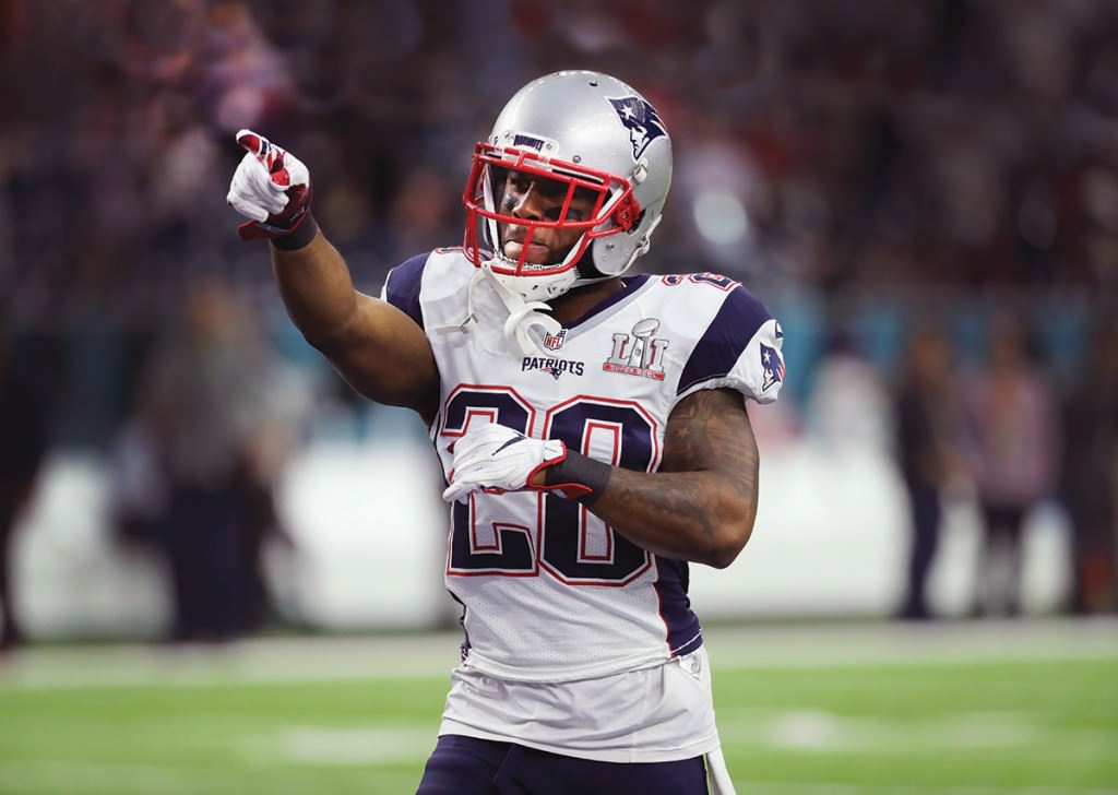 Candid shot of James White in New England Patriots uniform during football game.