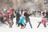 Students participate in a snowball fight on Bascom Hill.