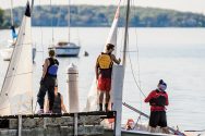 Members of the Hoofers Sailing Club bring their boats to a pier at the Memorial Union Terrace.