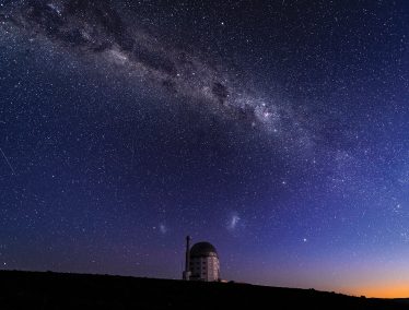 Nighttime sky showing the Milky Way behind the Southern African Large telescope in Sutherland, South Africa