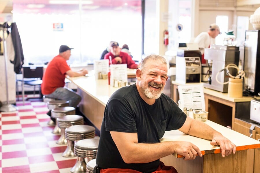 Bill Antonie seated at counter at The Curve