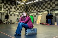 Rachel Rose sits on crate in production room at Industrial Light and Magic studio