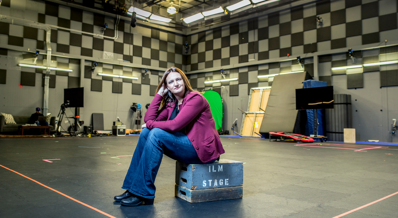 Rachel Rose sits on crate in production room at Industrial Light and Magic studio