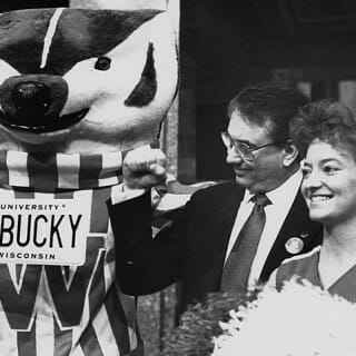 Tommy Thompson with UW Badgers cheerleader and Bucky Badger mascot