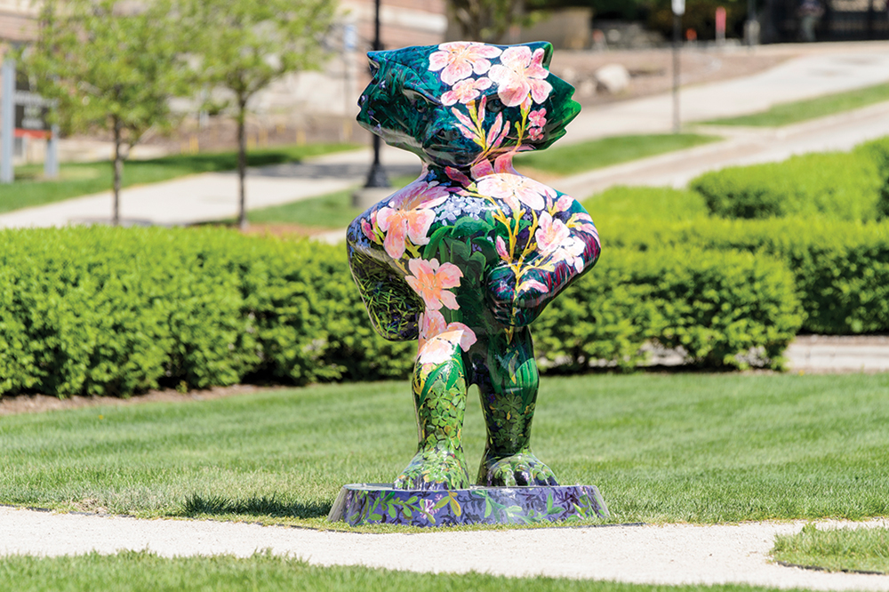 Bucky statue painted with bright pink flowers