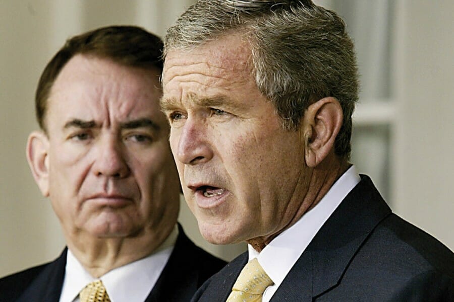 Tommy Thompson alongside President George W. Bush