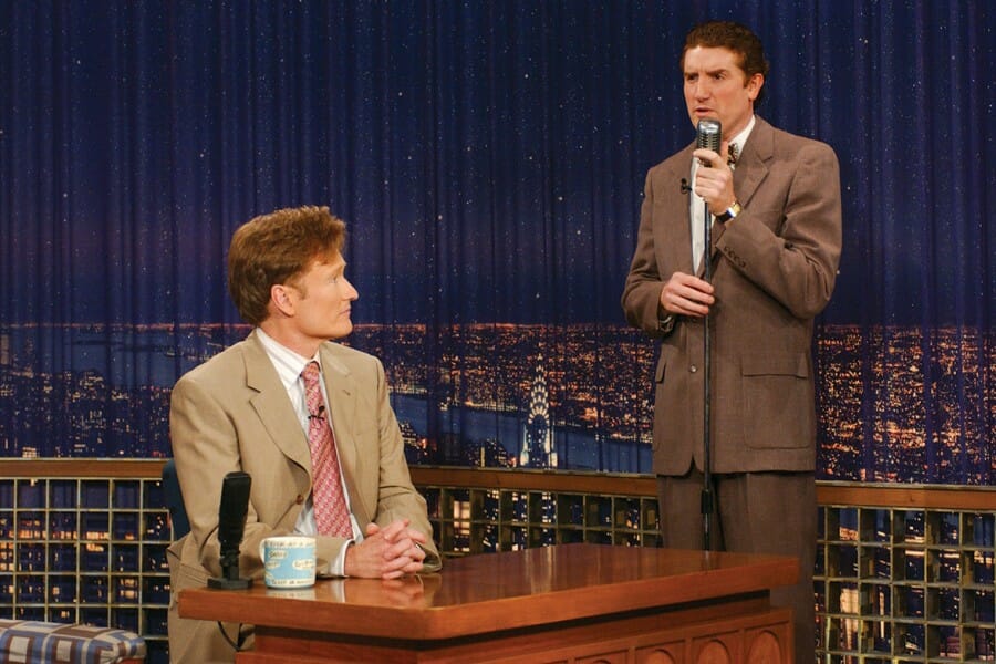 Brian Stack performs a skit with Conan O'Brien