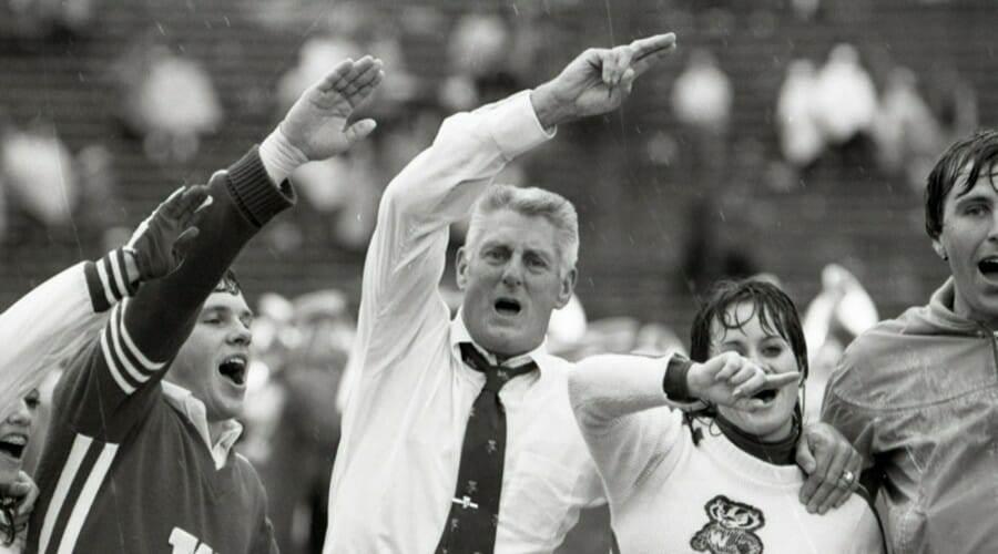 An older Elroy Hirsch with cheerleaders during a Los Angeles Rams game
