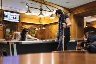 Two students play pool in the Memorial Union Der Stiftskeller