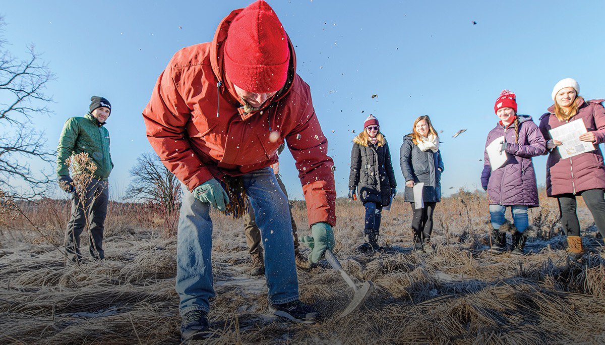 Douglas Rouse and his students collect frozen soil samples in the UW Arboretum.