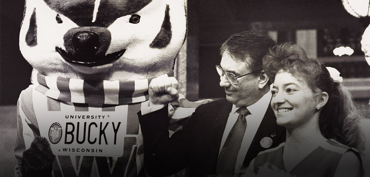 Tommy Thompson with UW Badgers cheerleader and Bucky Badger mascot