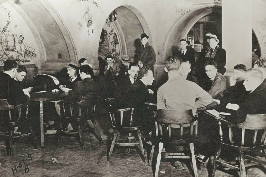 Historical black and white photo of students playing cards in the Memorial Union