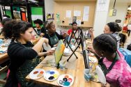 Students paint canvases in the Wheelhouse Studios at UW–Madison
