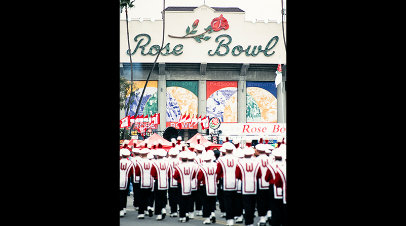 Members of the UW Marching Band stand outside the Rose Bowl Stadium