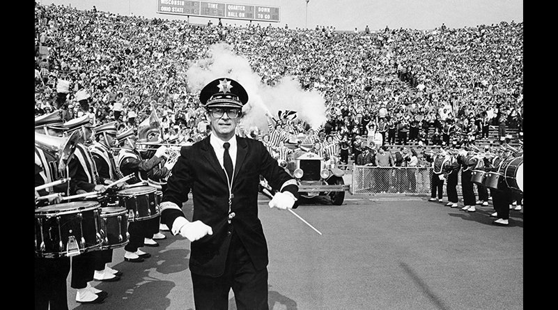 Mike Leckrone with members of the UW Marching Band in formation at Camp Randall Stadium