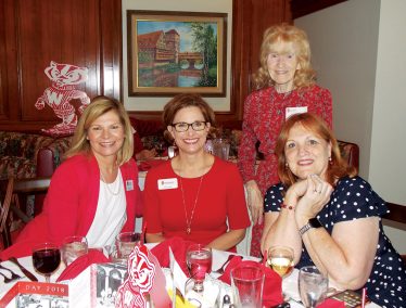 Renee Tuzee ’88; WAA Chief Alumni Officer Sarah Schutt; Virginia Porter ’58, MM’60; and Lea Davis enjoyed dinner at the Orange County Founders’ Day