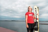 Gabbie Taschwer poses in front of Lake Mendota holding her water skis.