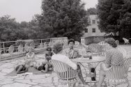 A group of 1960s female students relaxes in the Elizabeth Waters Residence Hall courtyard