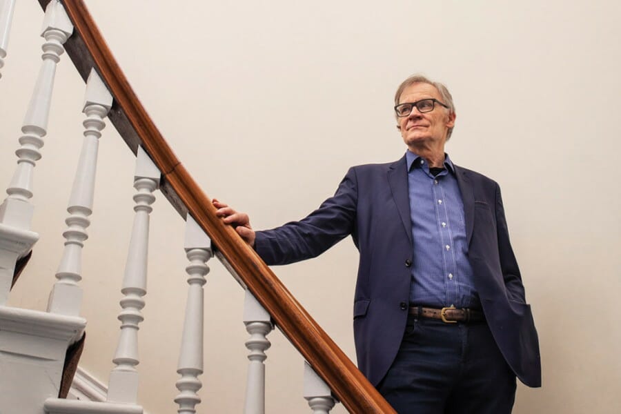 David Blight poses on staircase