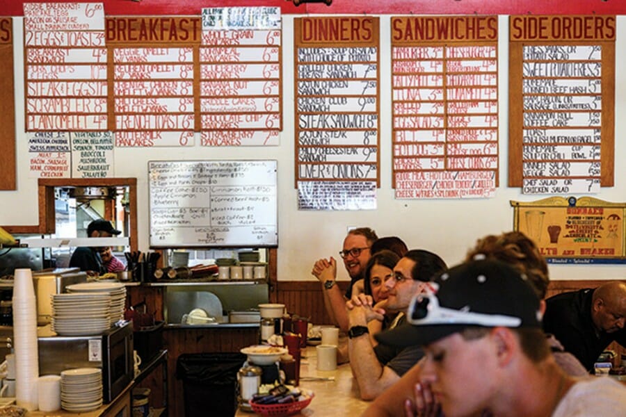 Handwritten menu on back wall of Mickie's Dairy Bar