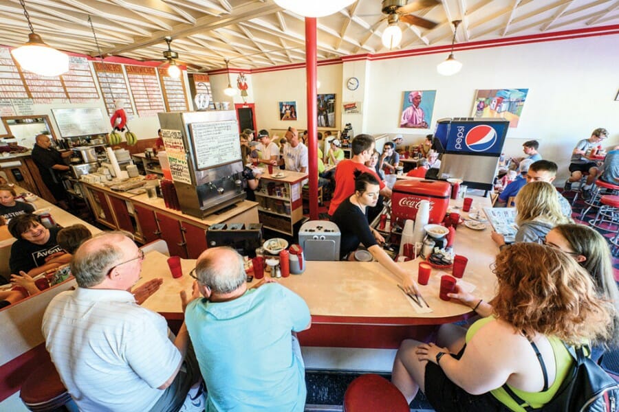 Patrons sit at counter at Mickie's Dairy Bar