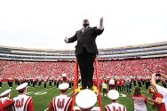 Corey Pompey conducts the UW Marching Band during a Badger football game