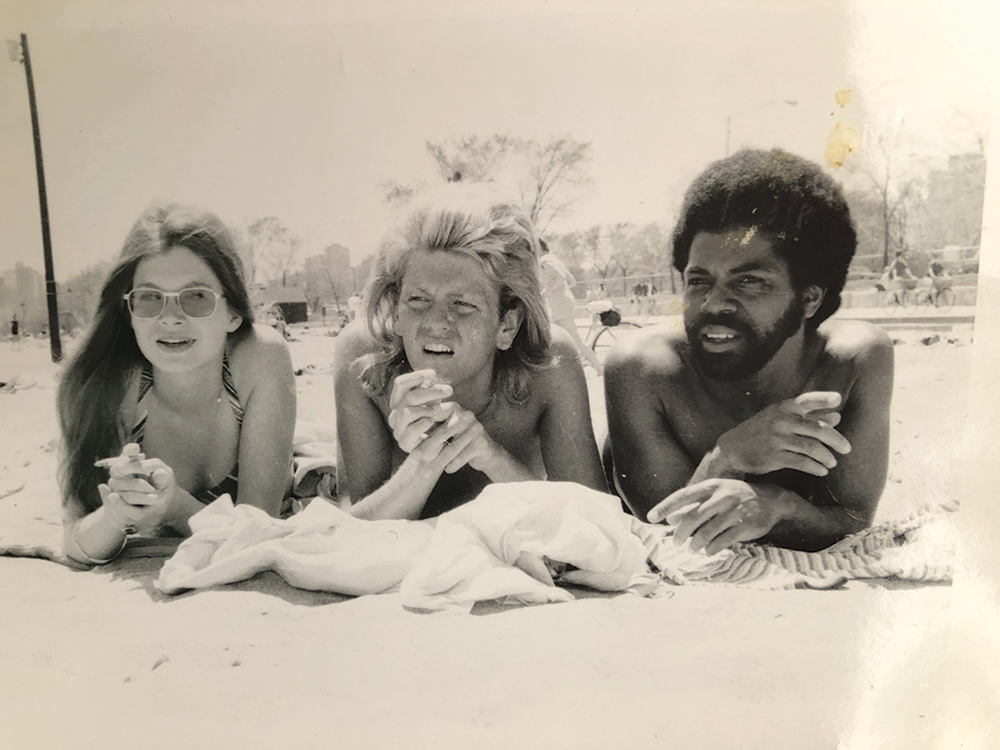 De Shield sunbathing with two friends in 1970