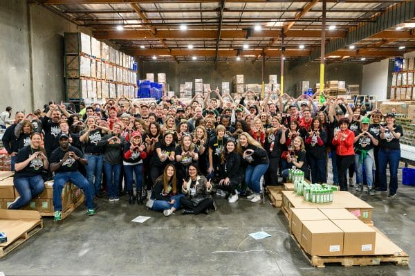 Volunteers from the University of Wisconsin–Madison and the University of Oregon gather for a group photo
