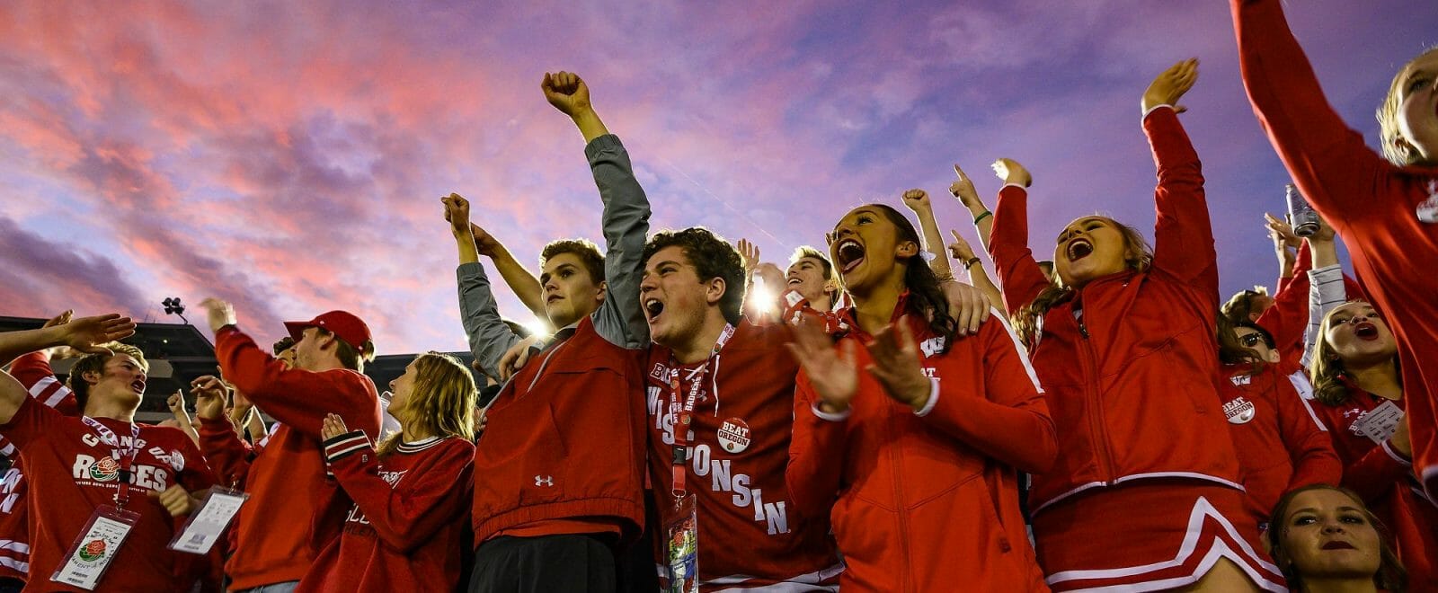 As the sun sets over the stadium, badger fans cheer on the team during the Rose Bowl Game in Pasadena, California on Jan. 1, 2020.
