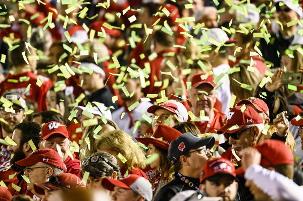 Badger fans are showered with Oregon green confetti following the conclusion of the Rose Bowl Game