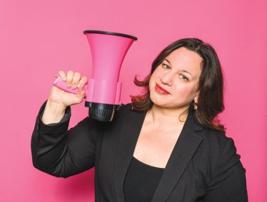 Veronica Rueckert holding a pink megaphone