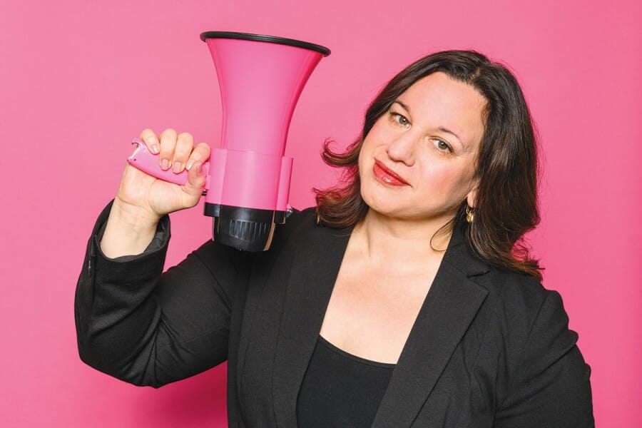 Veronica Rueckert holding a pink megaphone