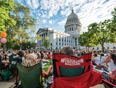 Spectators watch a performance on the Wisconsin state Capitol lawn