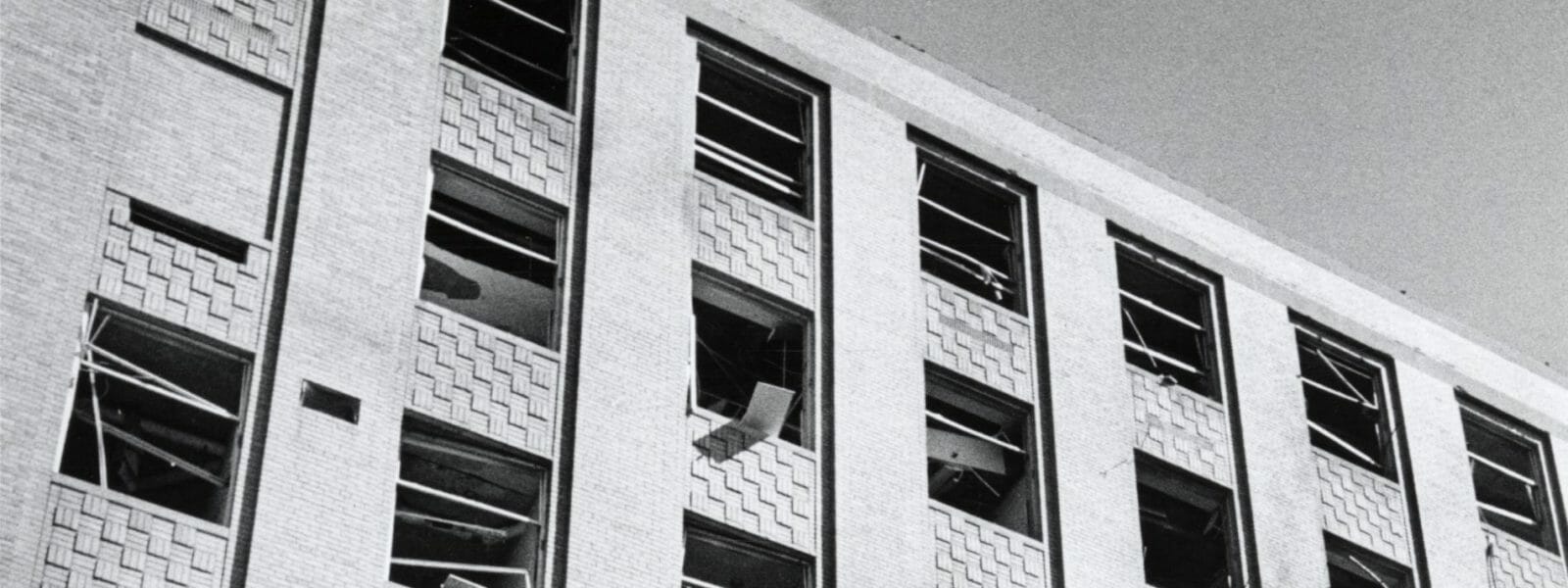 Side of Sterling Hall building with blown out windows