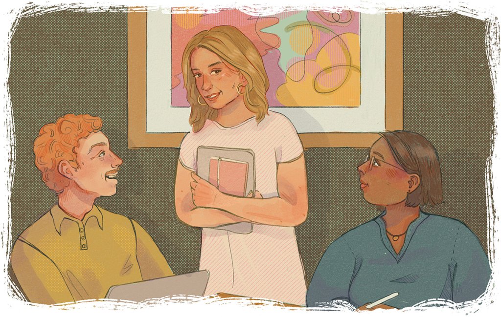 Three people gather in a room for a casual discussion—one stands holding a notebook, while the others sit engaged, one with a laptop and the other with a pen.