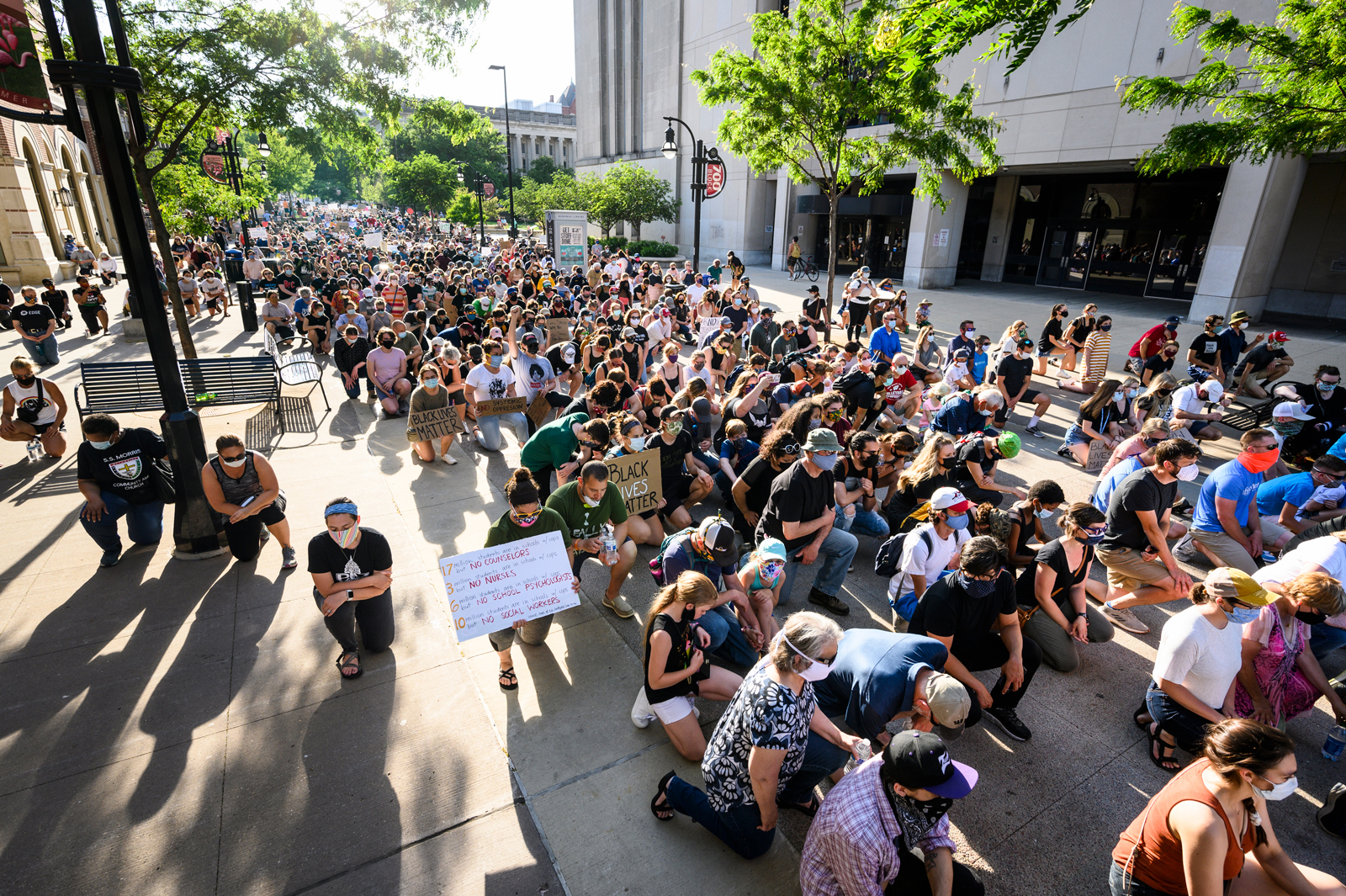 Protesters kneel near Memorial Library