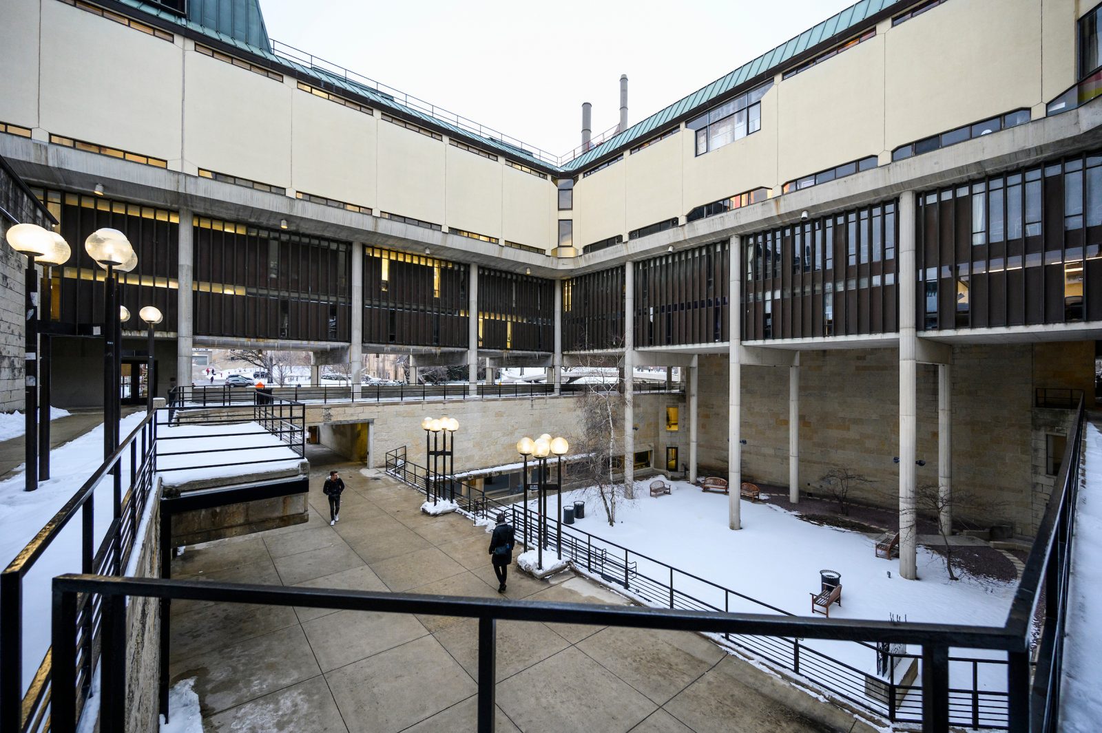 a snow-covered inner courtyard surrounded by concrete walls